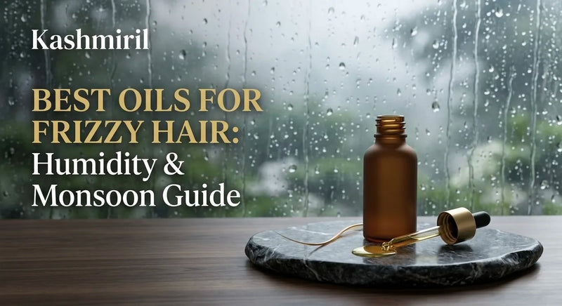 BEST OILS FOR FRIZZY HAIR: Humidity & Monsoon Guide by Kashmiril. Amber oil bottle with dropper on marble coaster against a rainy window backdrop, ideal for monsoon hair care.