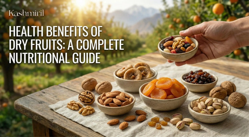 Hand holding a bowl of dry fruits with various bowls of nuts and dried fruits on a wooden table outdoors with featured text "Health Benefits Of Dry Fruits: A Complete Nutrition Guide"