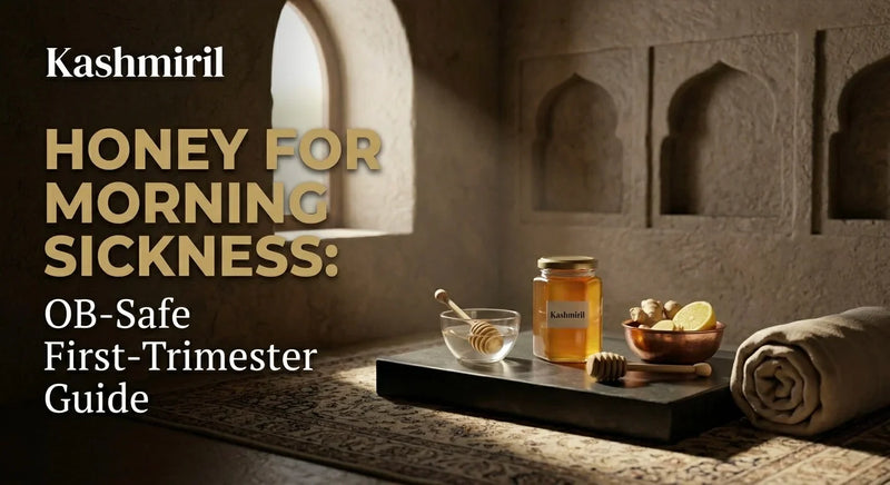 Kashmiril - Honey for Morning Sickness: OB-Safe First-Trimester Guide. Elegant still life with honey, ginger, and lemon in a serene stone setting.