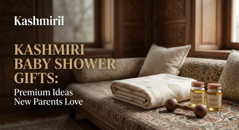 Kashmiril - KASHMIRI BABY SHOWER GIFTS: Premium Ideas New Parents Love. Folded soft baby blanket with almond and walnut oil jars and wooden rattle on patterned sofa.