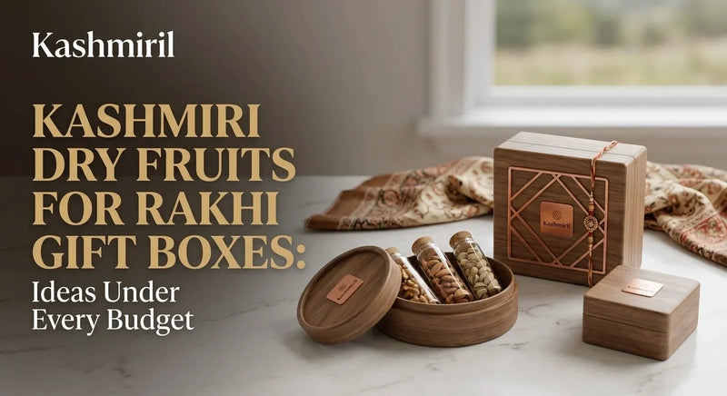 Kashmiril - KASHMIRI DRY FRUITS FOR RAKHI GIFT BOXES: Ideas Under Every Budget. Elegant wooden gift boxes and round container filled with almonds and pistachios on marble with rakhi thread.