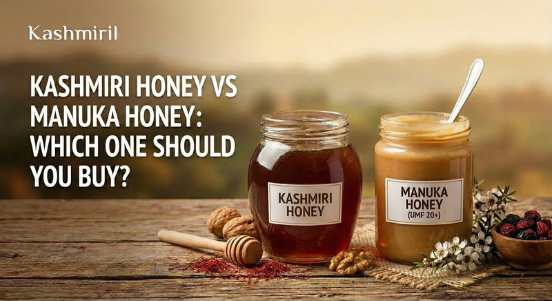 Kashmiri Honey vs Manuka Honey: Which One Should You Buy? – Side-by-side comparison showing a jar of dark amber Kashmiri honey and creamy Manuka honey on a rustic wooden table with honey dipper, walnuts, saffron strands, and Kashmiri botanicals.