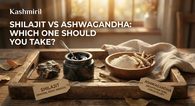 Wooden tray with Shilajit, Ashwagandha, and other natural elements on a wooden surface with featured text "Shilajit Vs Ashwangandha: Which One Should You Take?