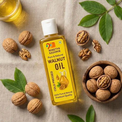 Kashmiril's walnut oil bottle with walnuts and leaves on a textured surface