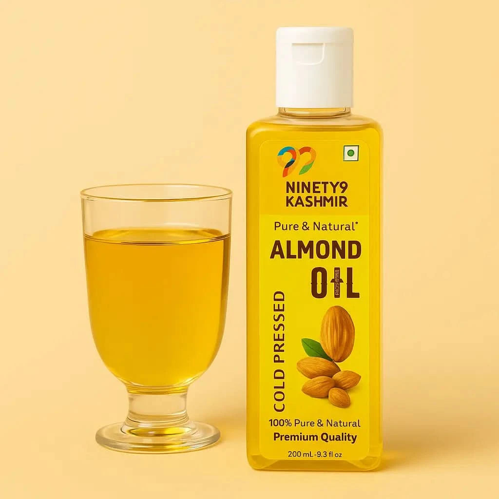 Kashmiril almond oil bottle with a glass of oil on a beige background