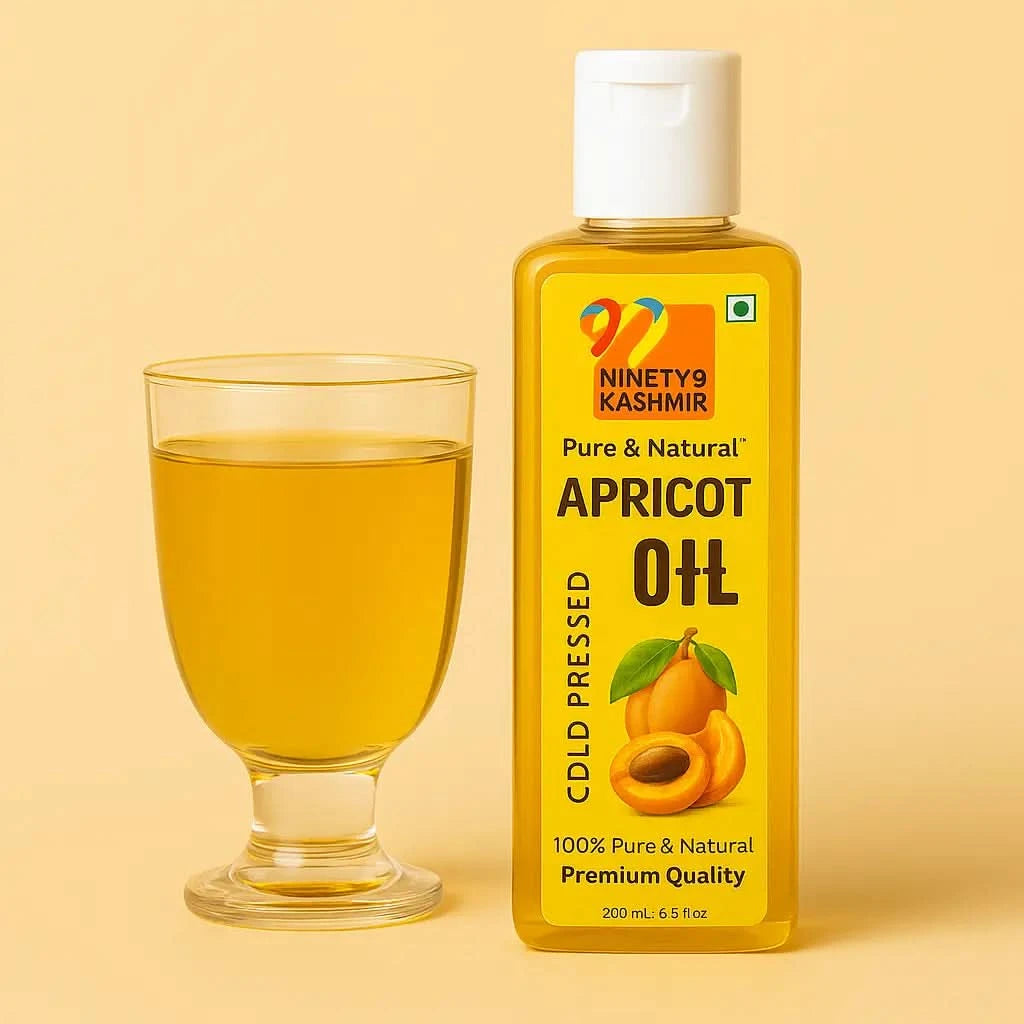 Bottle of Kashmiril Apricot Oil with a glass of oil on a beige background