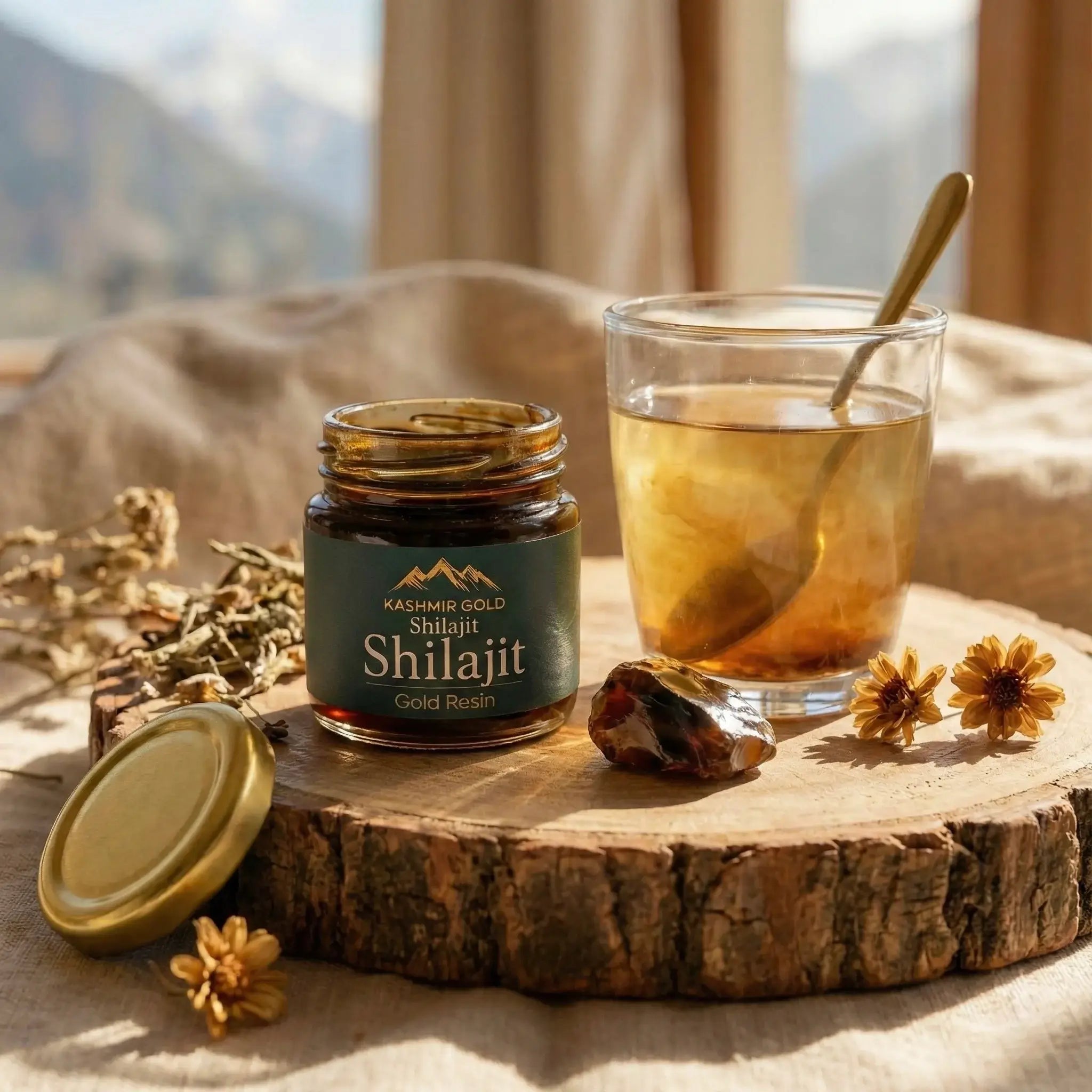 Jar of Shilajit with a glass of liquid on a wooden surface with a mountainous background