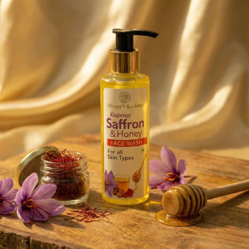Bottle of Kashmiril Ninety9 Kashmiri Saffron & Honey Face Wash on a beige background