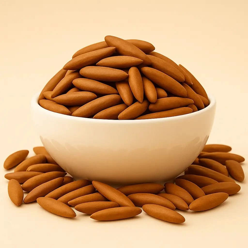 White bowl filled with Pine Nuts on a beige background