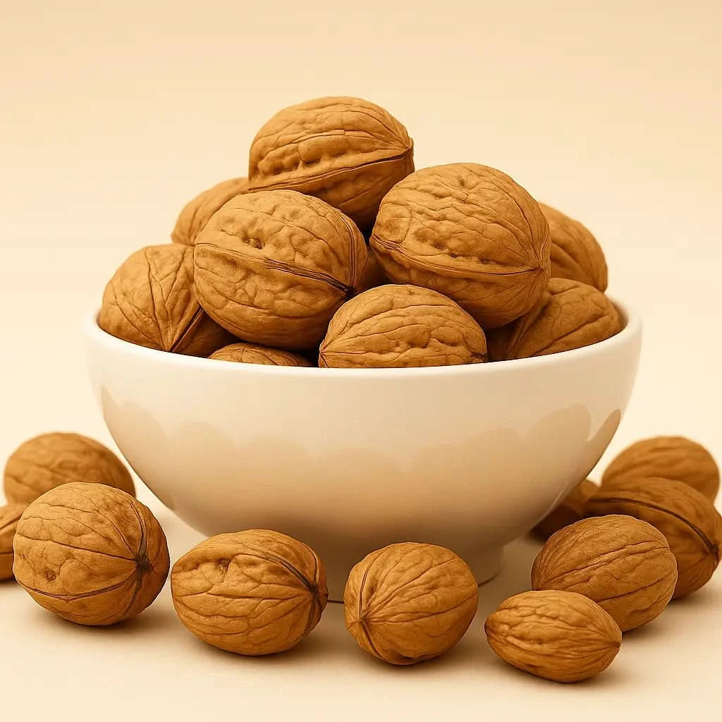 White bowl filled with walnuts on a beige background