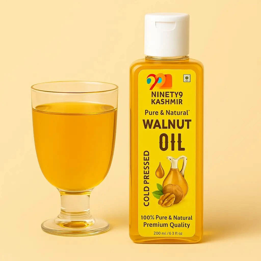 Bottle of Kashmiril Walnut Oil with a glass of oil on a beige background
