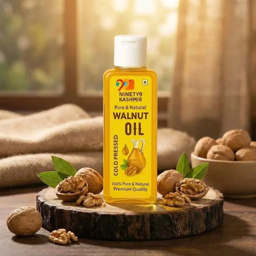 Bottle of Kashmiril Walnut Oil with a glass of oil on a beige background